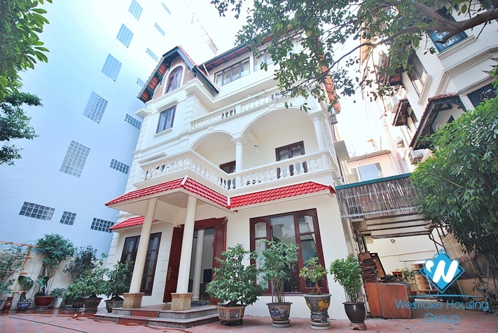 Charming house with nice design and big yard for rent in To Ngoc Van, Tay Ho, Ha Noi